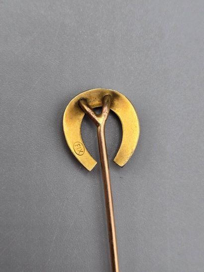 Set of three tie pins: 
- gilt metal tie...