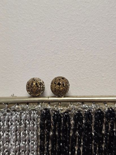 Evening clutch in silver-plated metal set...