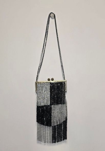 Evening clutch in silver-plated metal set...