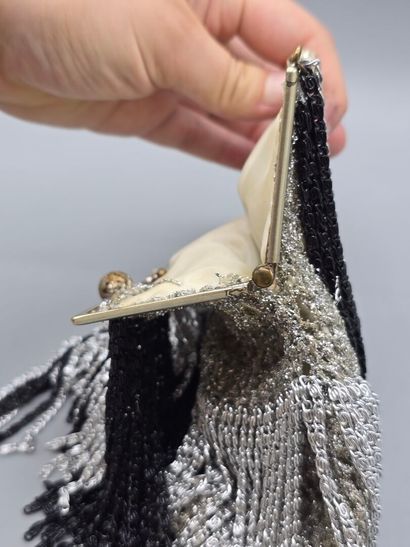 Evening clutch in silver-plated metal set...