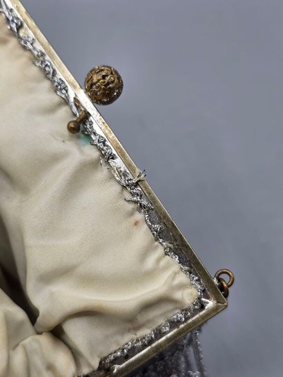 Evening clutch in silver-plated metal set...