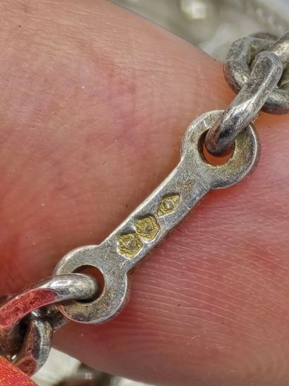 Lot de 4 éléments en argent et métal:
- un...