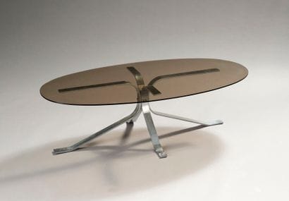 Lounge table with oblong top in smoked glass.
Chrome-plated...