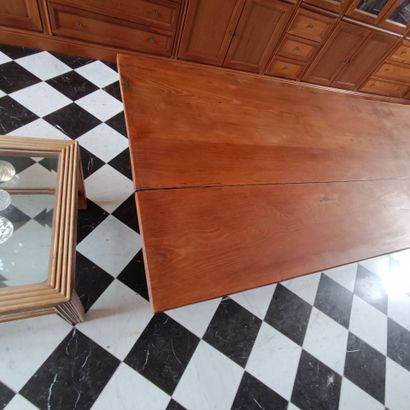 In the bookcase
Large rectangular table in...