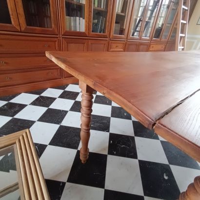 In the bookcase
Large rectangular table in...