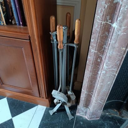 In the library
A metal fireplace set including...