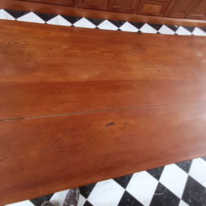 In the bookcase
Large rectangular table in...