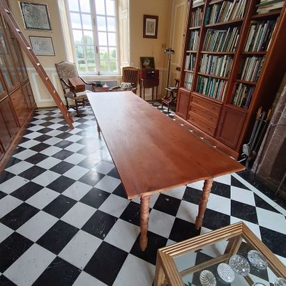 In the bookcase
Large rectangular table in...