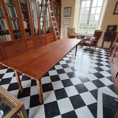 In the bookcase
Large rectangular table in...