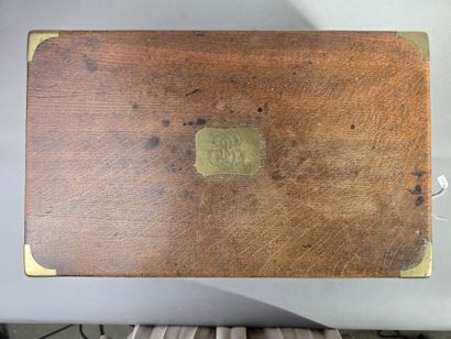 A large wooden household set with brass handles...