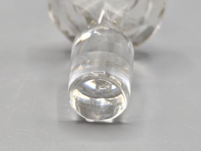 A white crystal decanter with its stopper...