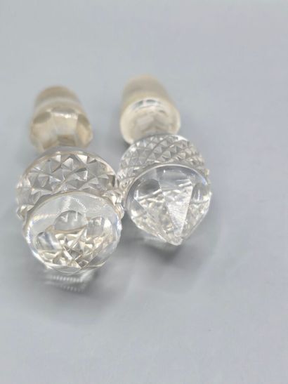 Pair of white crystal decanters with stoppers...