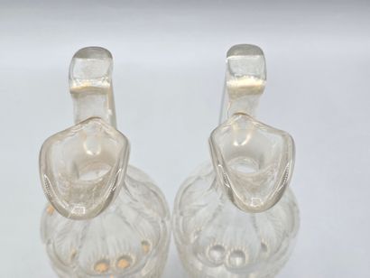 Pair of white crystal decanters with stoppers...