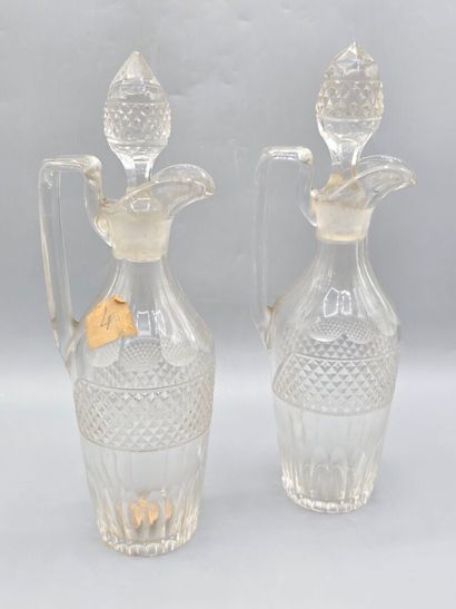 Pair of white crystal decanters with stoppers...