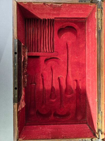A large wooden household set with brass handles...