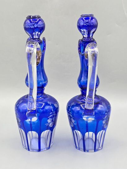A pair of blue crystal decanters.
Two stoppers...