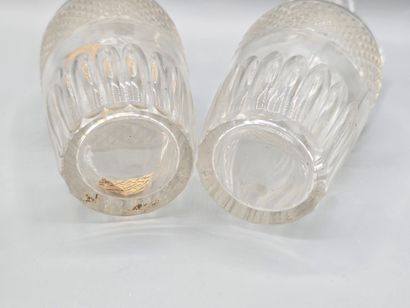 Pair of white crystal decanters with stoppers...