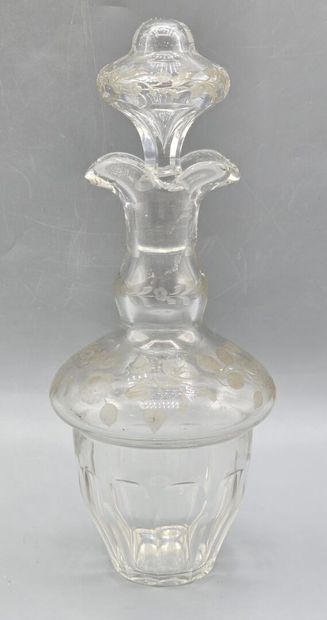 A white crystal decanter with its stopper...