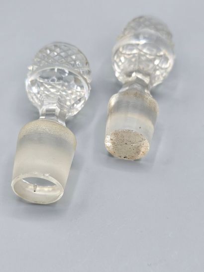 Pair of white crystal decanters with stoppers...