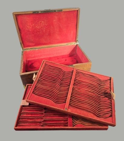 A large wooden household set with brass handles...