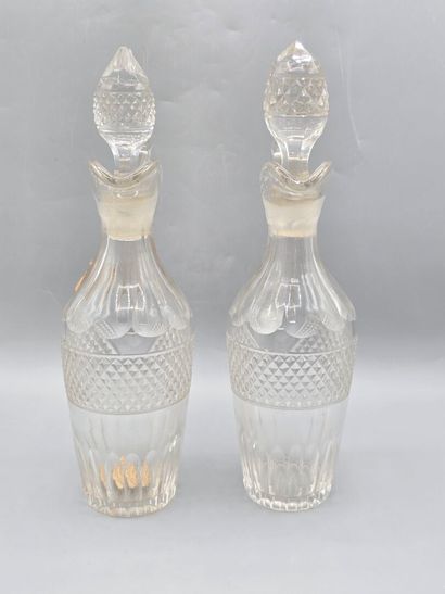 Pair of white crystal decanters with stoppers...