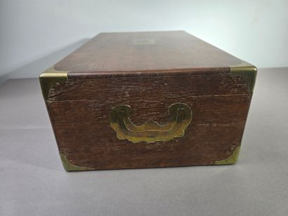 A large wooden household set with brass handles...