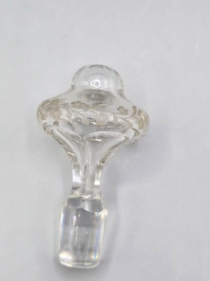 A white crystal decanter with its stopper...