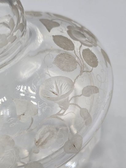A white crystal decanter with its stopper...