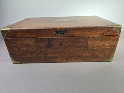 A large wooden household set with brass handles...
