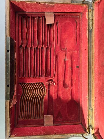 A large wooden household set with brass handles...