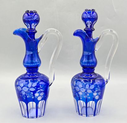 A pair of blue crystal decanters.
Two stoppers...