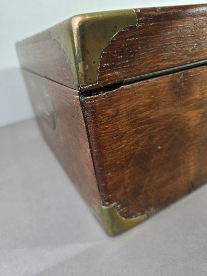 A large wooden household set with brass handles...