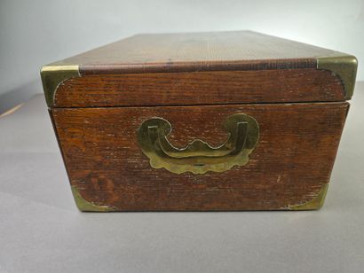 A large wooden household set with brass handles...