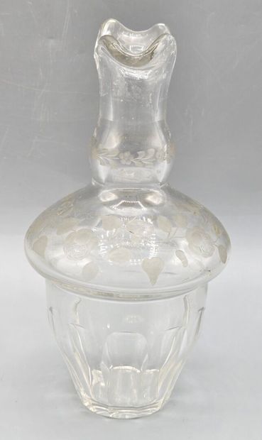 A white crystal decanter with its stopper...