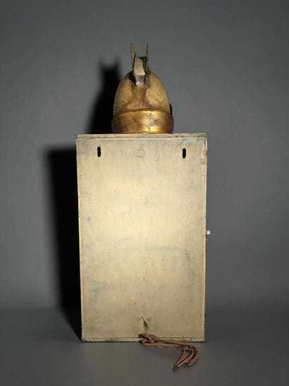 A half-moon-shaped wall sconce with a curved...