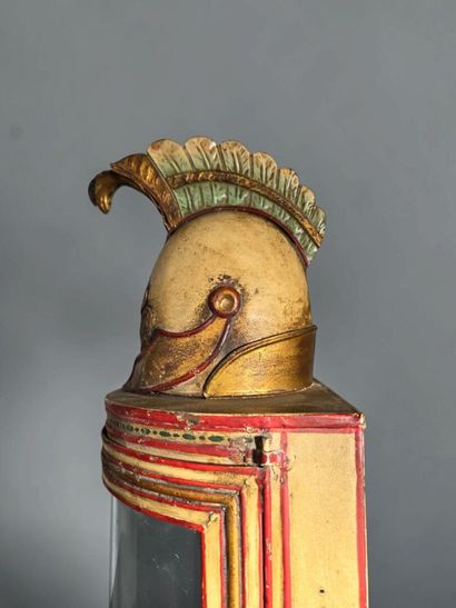 A half-moon-shaped wall sconce with a curved...