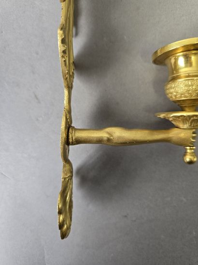 Pair of gilded, chiseled bronze wall sconces...