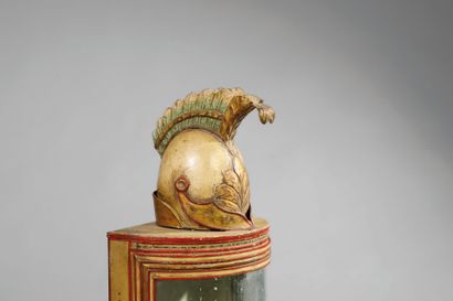 A half-moon-shaped wall sconce with a curved...
