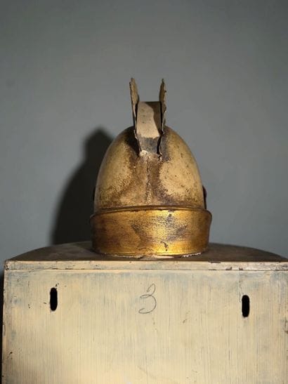 A half-moon-shaped wall sconce with a curved...
