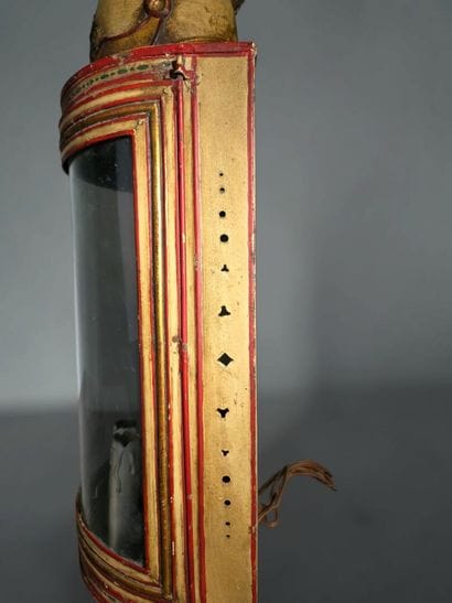 A half-moon-shaped wall sconce with a curved...