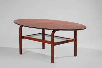 Rosewood coffee table.
Oblong tabletop.
Supports...
