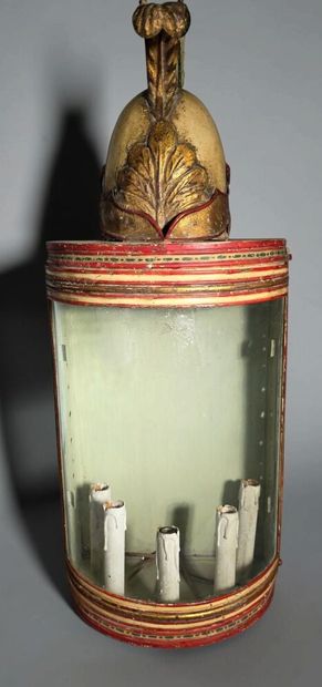 A half-moon-shaped wall sconce with a curved...