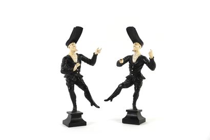 Two acrobats in ivory and blackened wood...