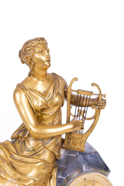 Gilded bronze clock representing a woman...