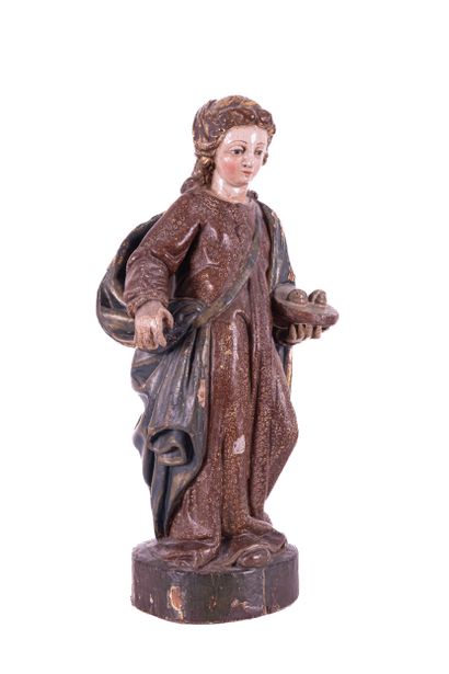 Saint Lucia in wood carved in the round with...