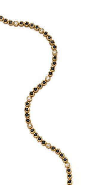 Bracelet tennis en or jaune 18K (750/1000)...