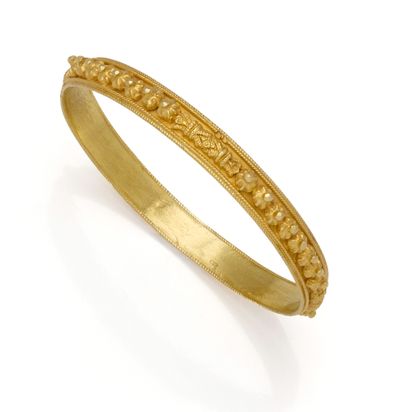 Jonc en or jaune 18K (750/1000) appliqué...
