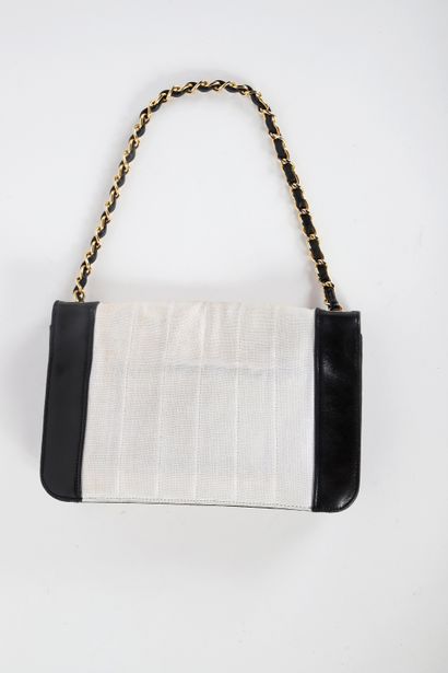 CHANEL 
Classic bag in beige canvas and black...