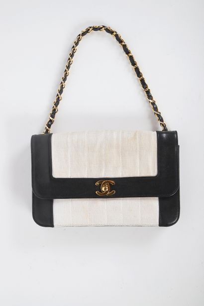 CHANEL 
Classic bag in beige canvas and black...
