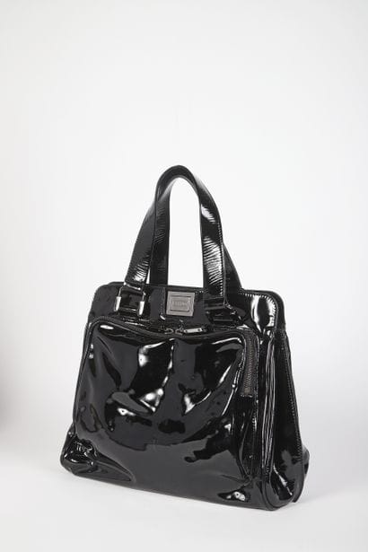 CÉLINE
Black patent leather bag with double...